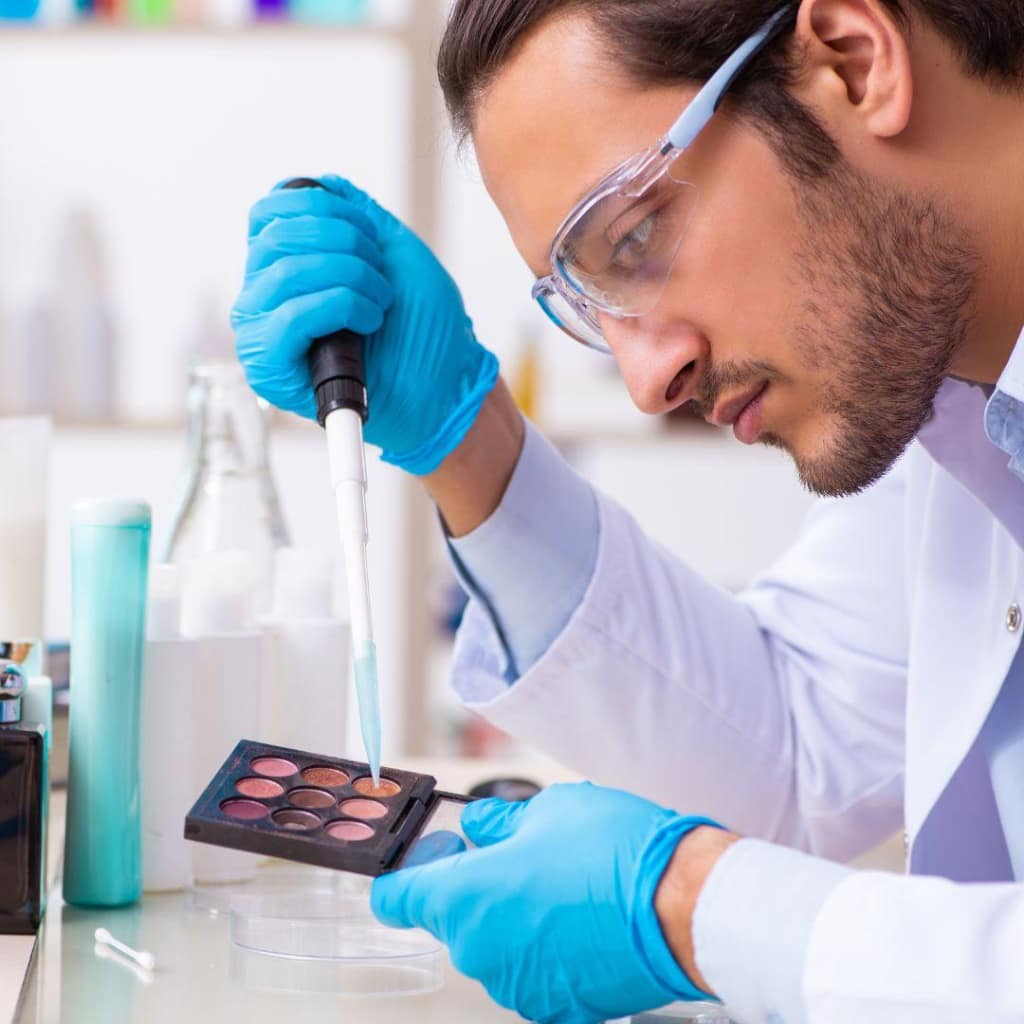Cosmetic laboratory sample development process showing formula testing and skincare makeup R&D in a professional beauty factory.